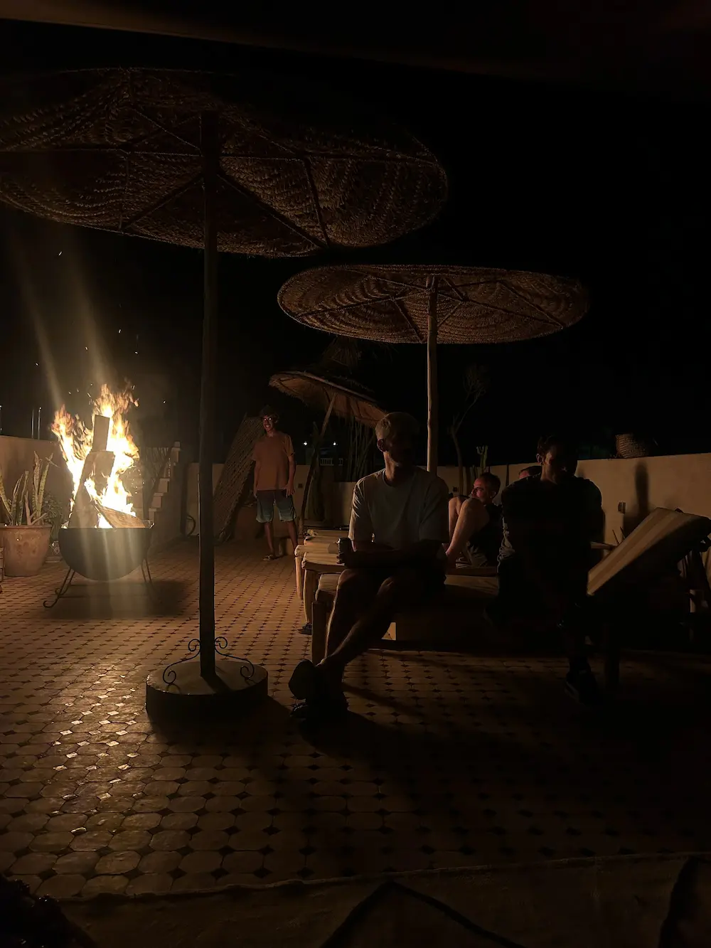 Bonfire Gathering Patio Night Morocco at The Yogi Surfer in Taghazout Bay, Morocco.