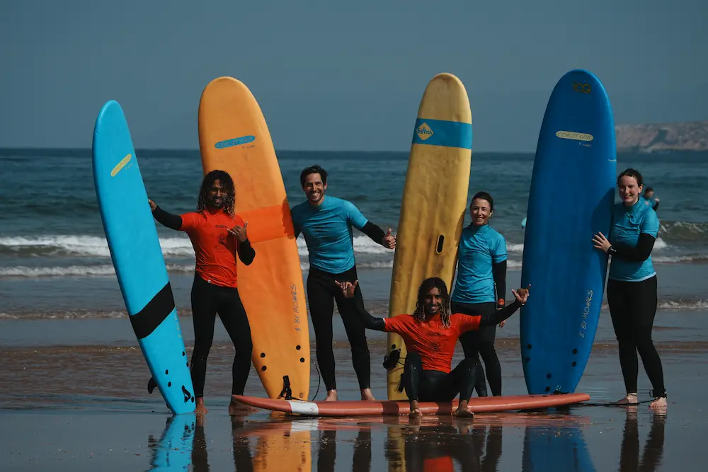 Group Surf Lesson on Taghazout Beach - Morocco at The Yogi Surfer in Taghazout Bay, Morocco.