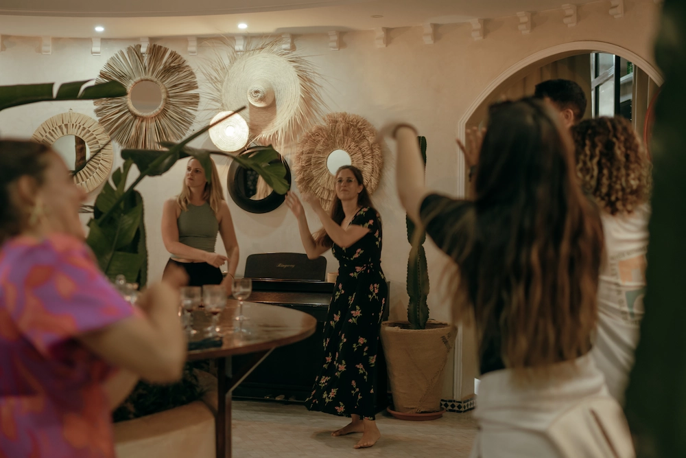 Group Dancing at Yogi Surfer Villa Party at The Yogi Surfer in Taghazout Bay, Morocco.