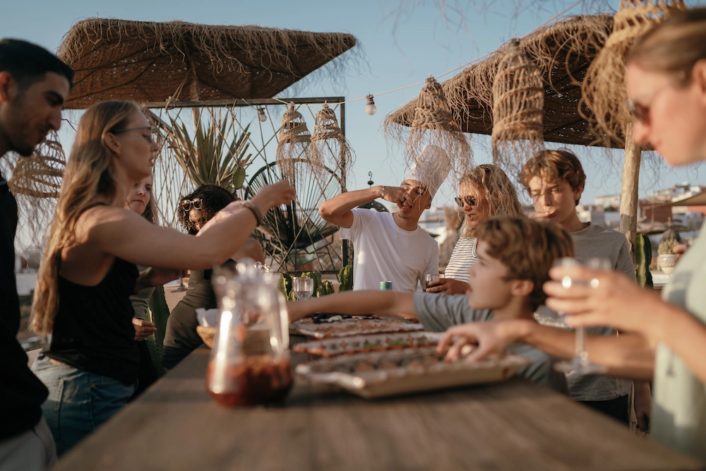 Terrace Gathering with Food and Drinks in Morocco at The Yogi Surfer in Taghazout Bay, Morocco.