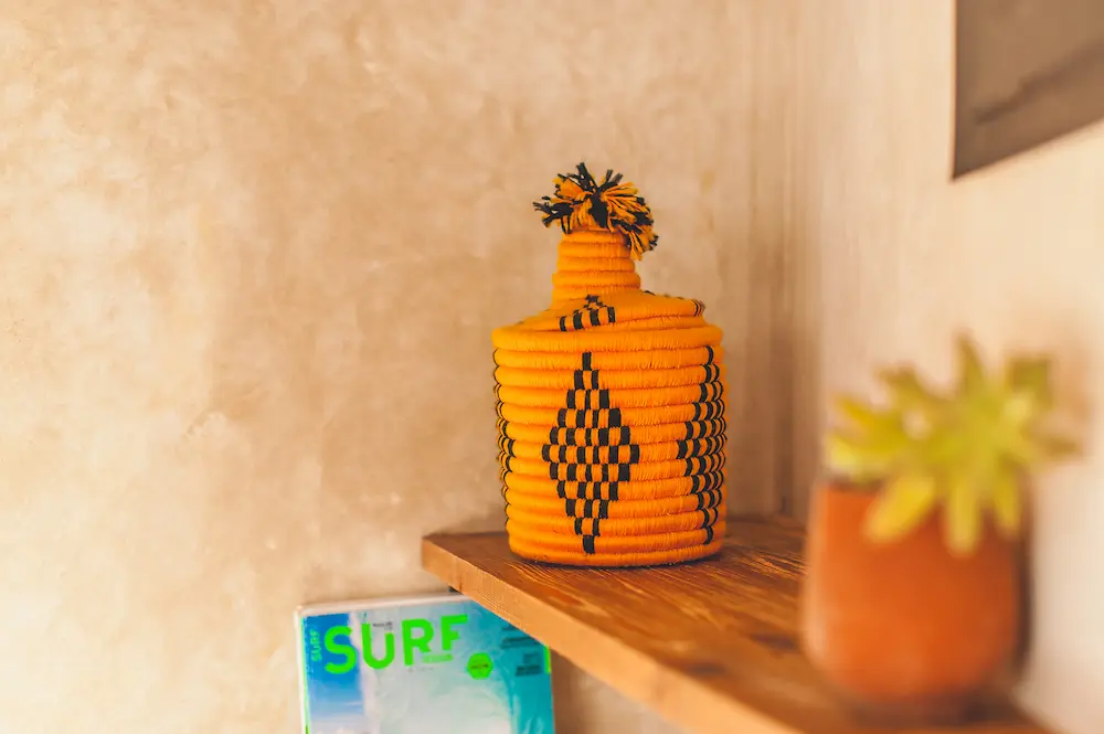 Moroccan textiles and wall decor in the triple sea-view room