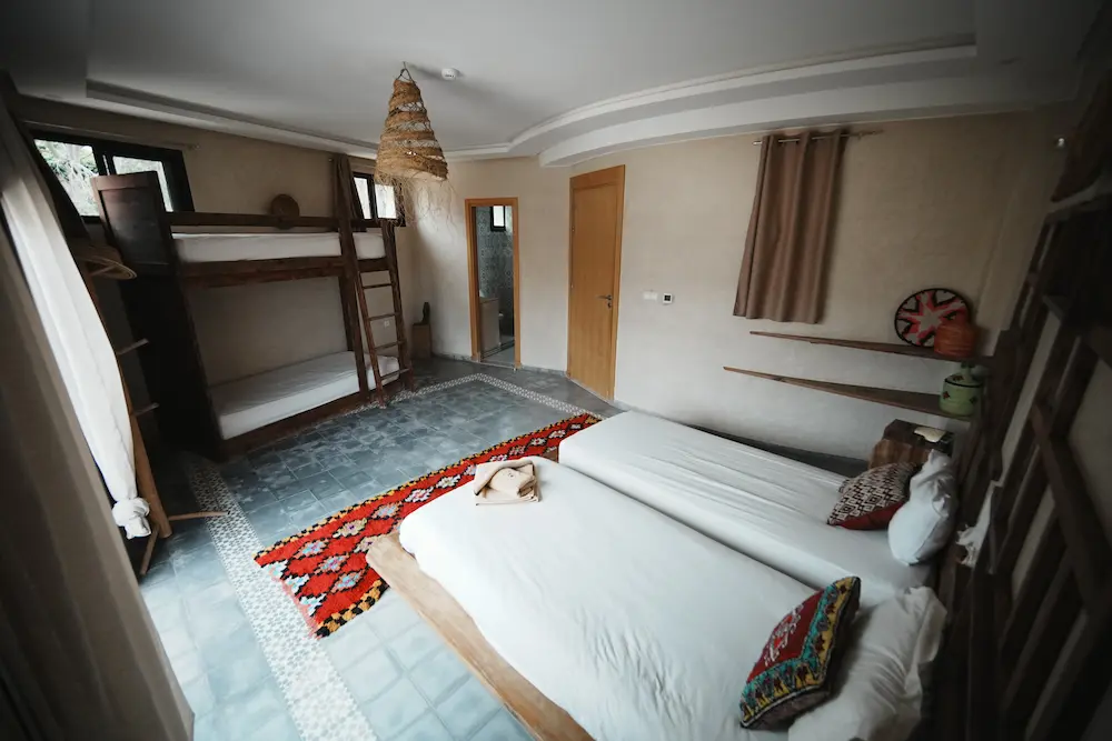 The female dorm, with the beds spaced apart rather than bunked