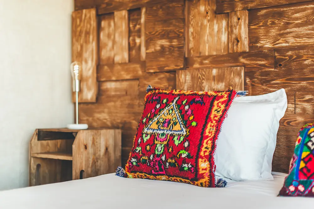 A double ocean-view room seen from the side of the bed