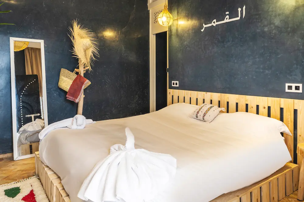The large bed in the Moon Room, under a bright window