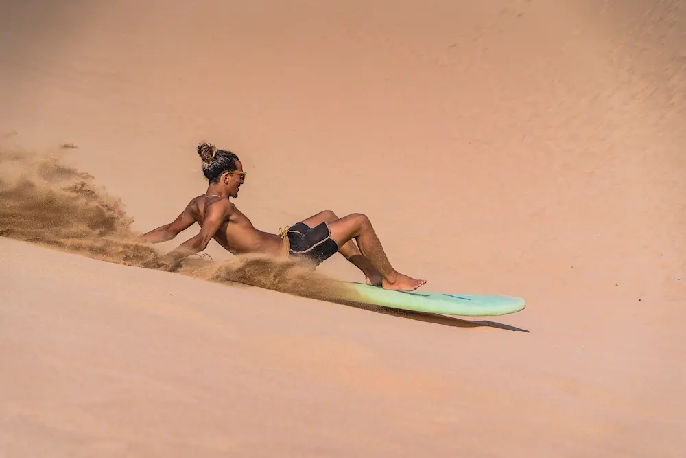 Sandboarding the Timlalin Dunes - Morocco at The Yogi Surfer in Taghazout Bay, Morocco.