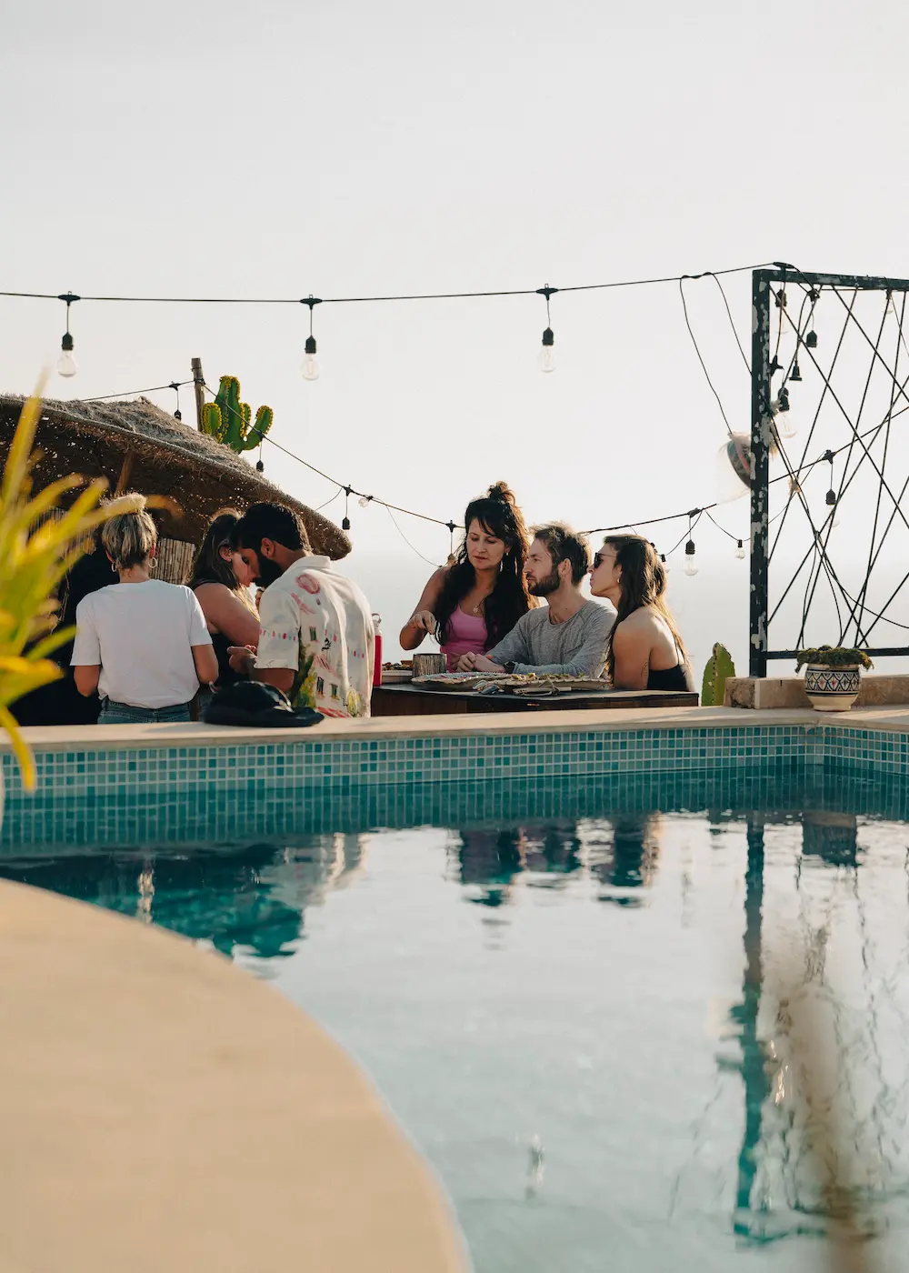 Guests sitting and talking on the rooftop terrace