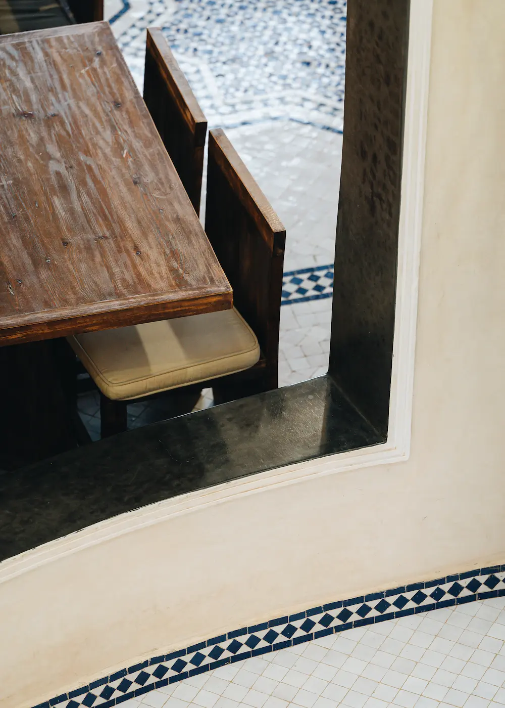 The long communal dining table where guests eat together