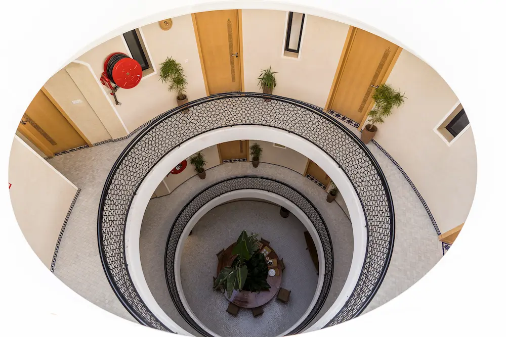 The building interior seen looking down from the top floor