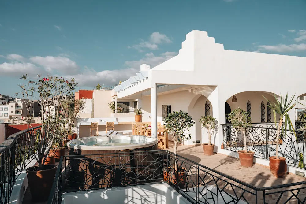 The full roof terrace, with the hot tub at one end and the dining area at the other