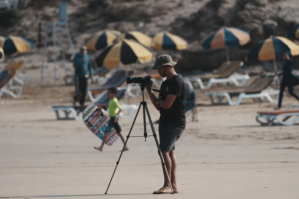 Surf Photographer Filming on the Beach - Taghazout at The Yogi Surfer in Taghazout Bay, Morocco.